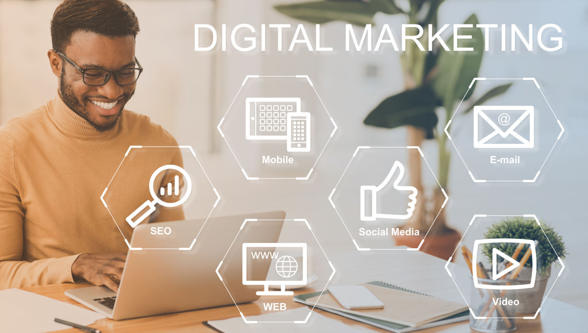 Digital marketing concept. Set of internet commerce icons on virtual screen and happy businessman working with laptop, collage. Panorama